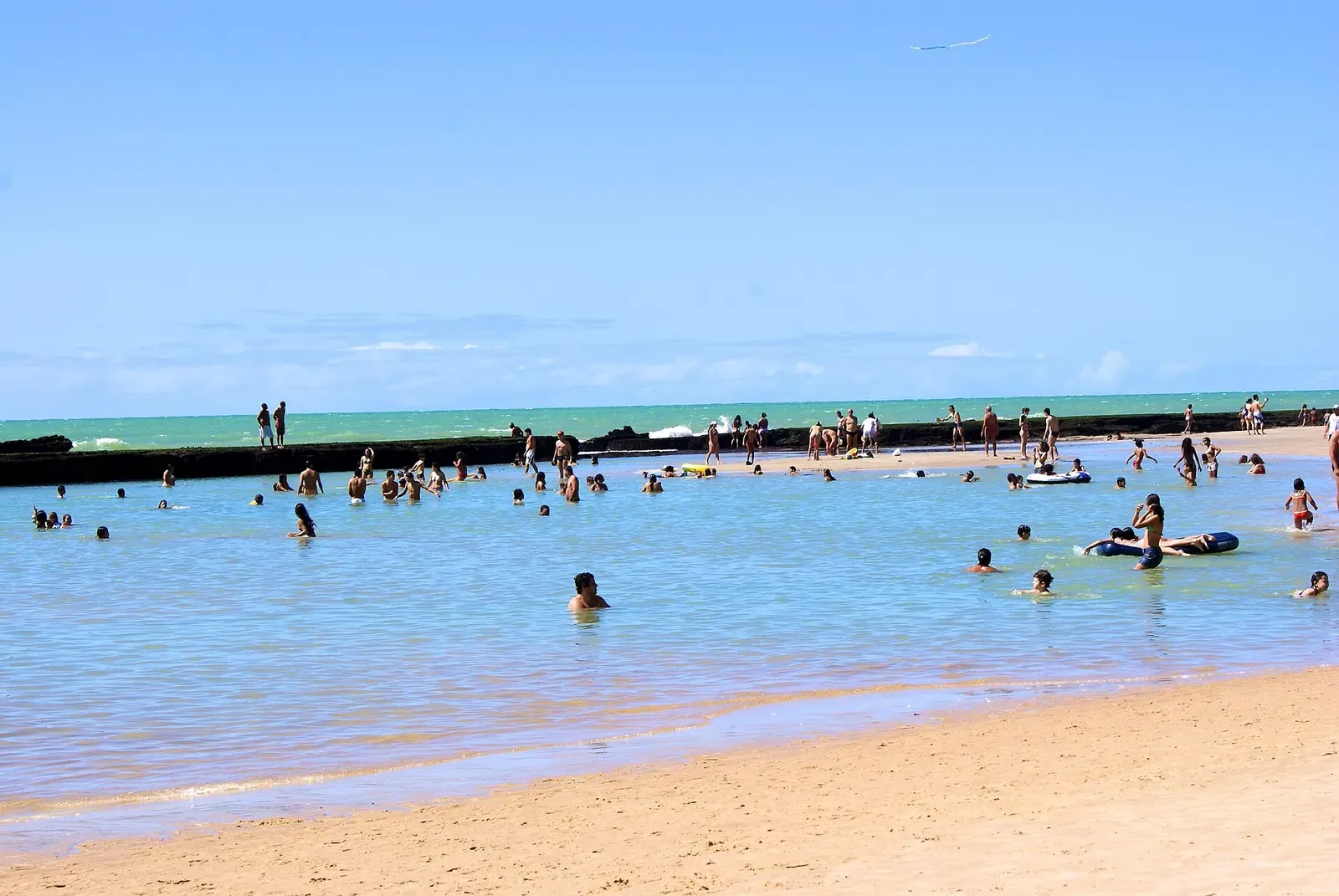 Natural reef breakwater along Boa Viagem beach in Recife, the rocky formation that gives the city its name — Recife Wrecks