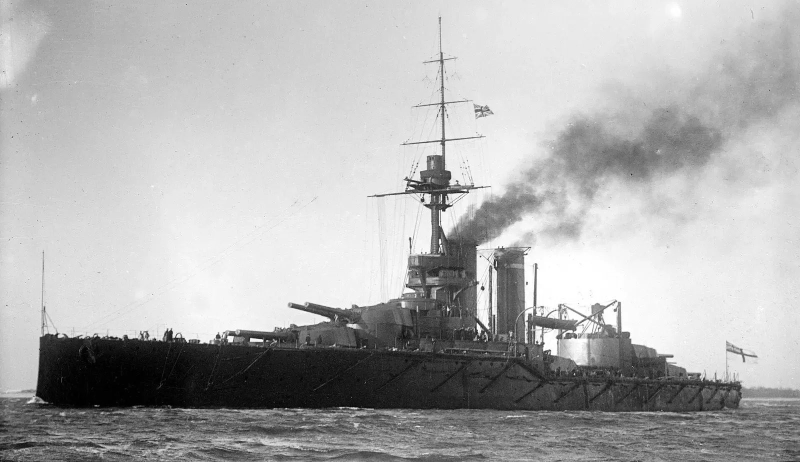 HMS Audacious steaming at sea with her twin funnels and forward gun turrets visible — Malin Head.