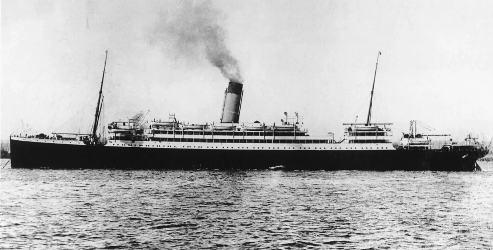 Broadside view of Laurentic steaming with light smoke trailing from her funnels — SS Laurentic, Malin Head.