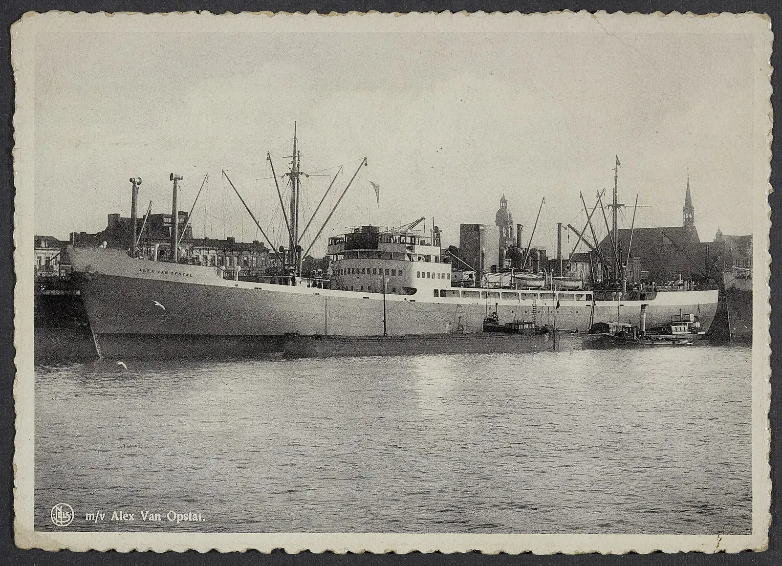 Postcard photo of the motor vessel Alex Van Opstal moored in harbour