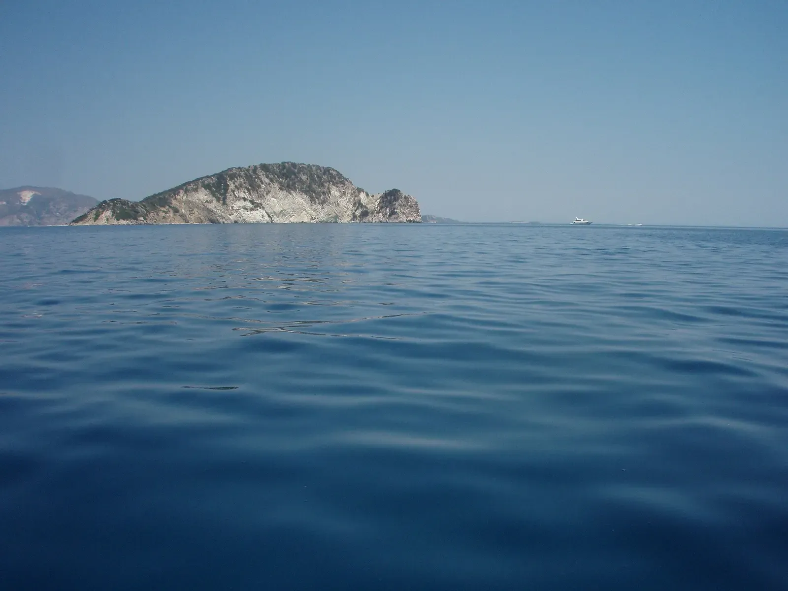 Marathonisi island seen from the sea, showing the western side of the island.