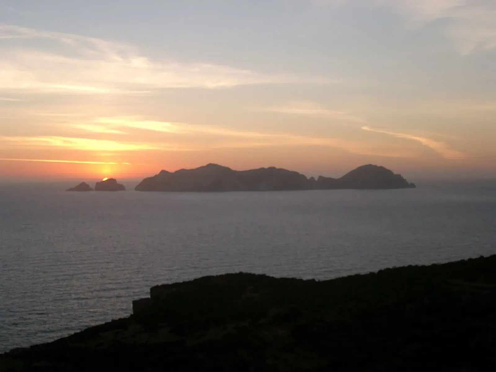 Silhouette of Palmarola island at sunset, seen across the water from Ponza
