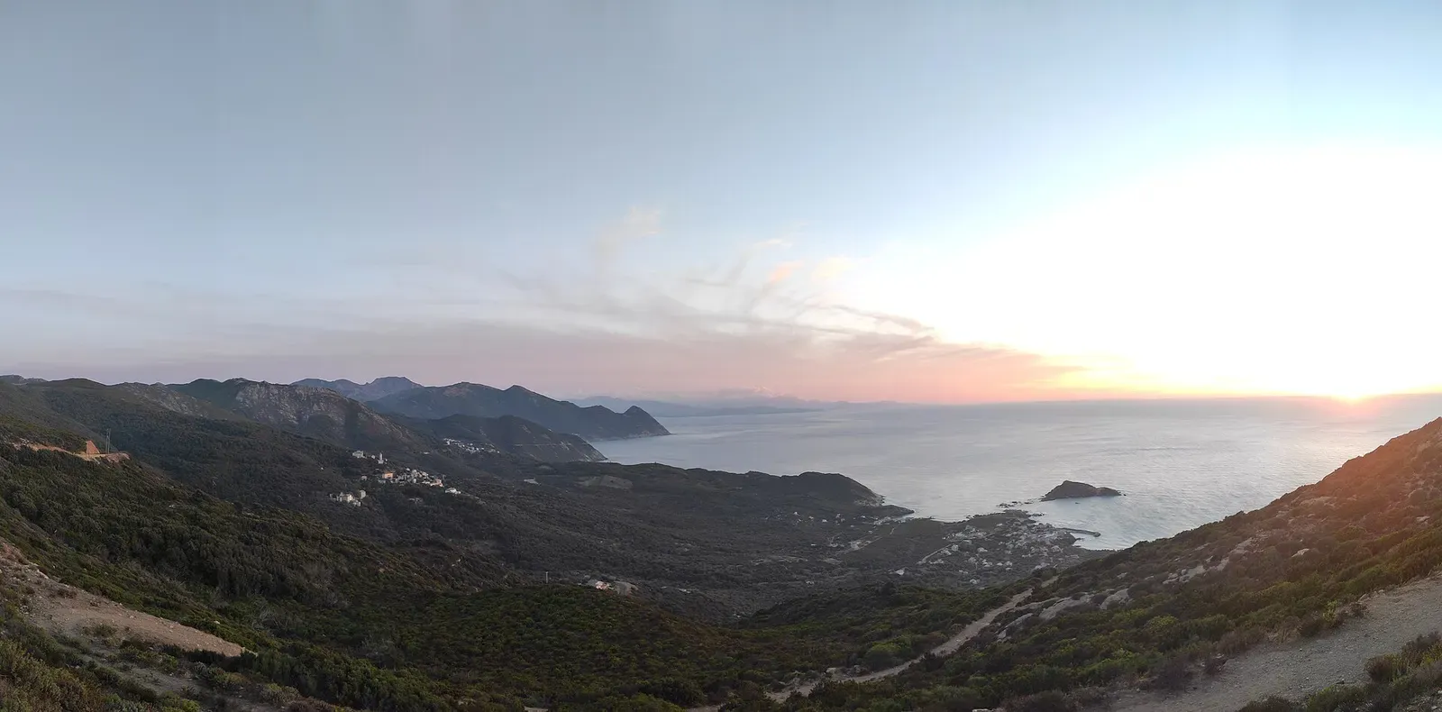 Panoramic view along Cap Corse's mountainous coastline at sunset