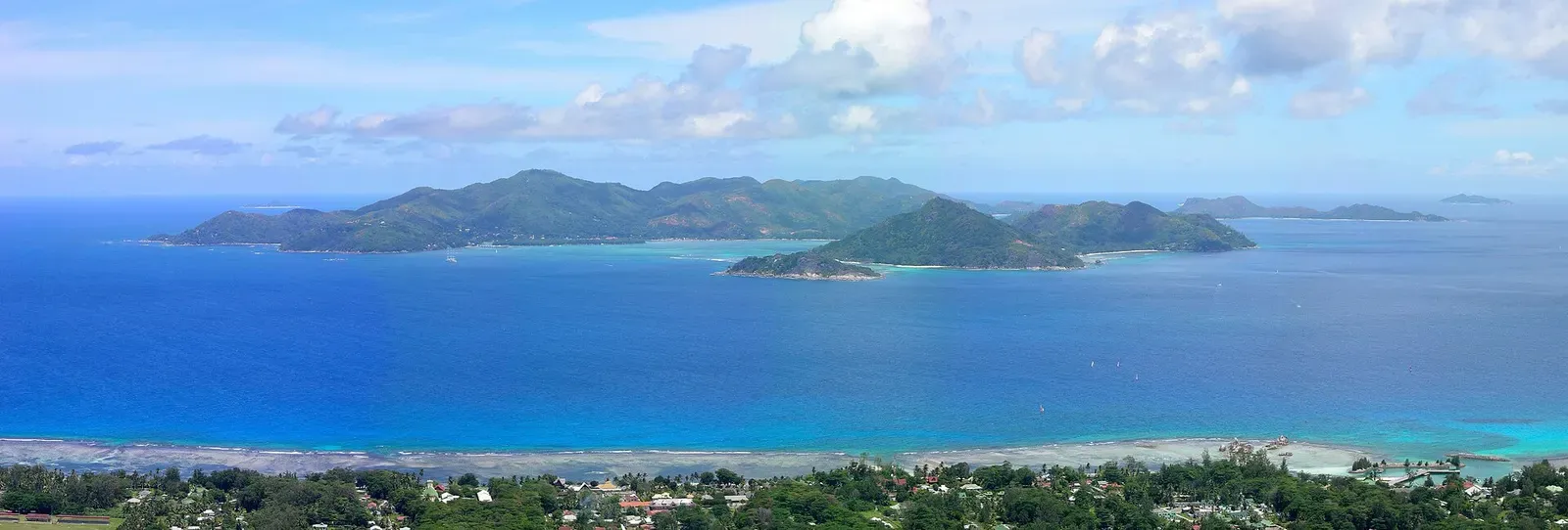 Panoramic view of Praslin island seen across the channel from La Digue's Nid d'Aigle