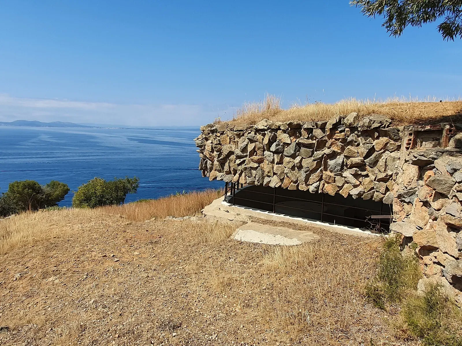 Clifftop view of the sea from the Falconera headland beside an old stone bunker — Punta Falconera, Cap de Creus