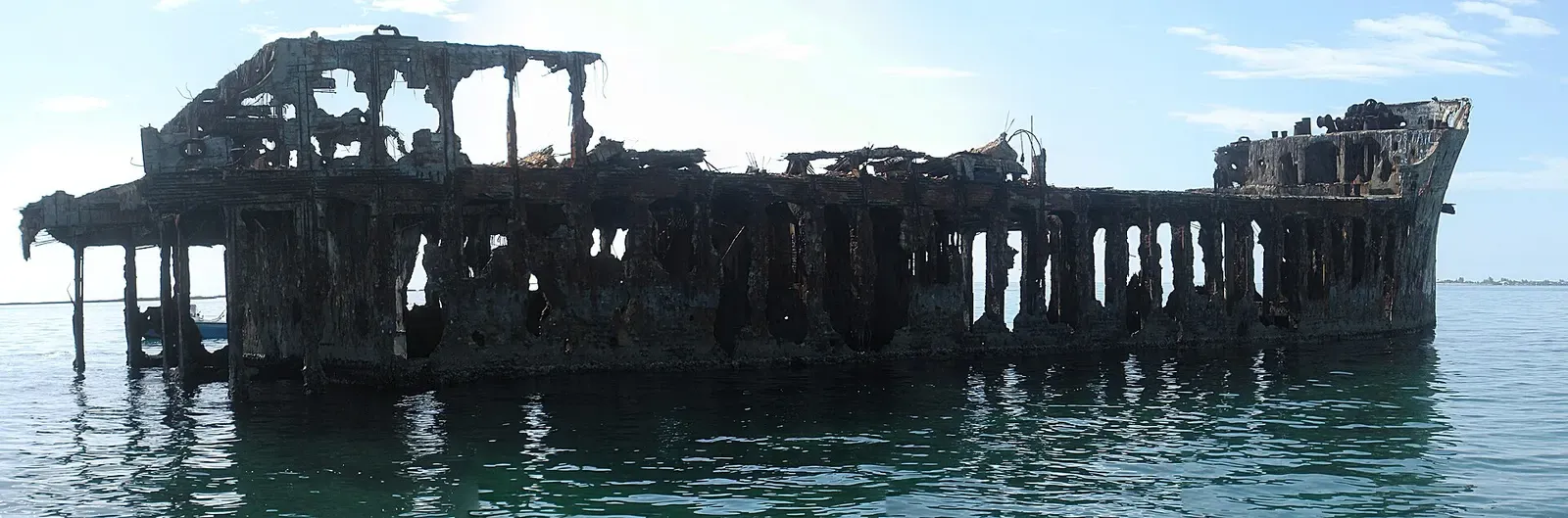 Skeletal rusted framework of the SS Sapona's starboard side at low tide — Bimini