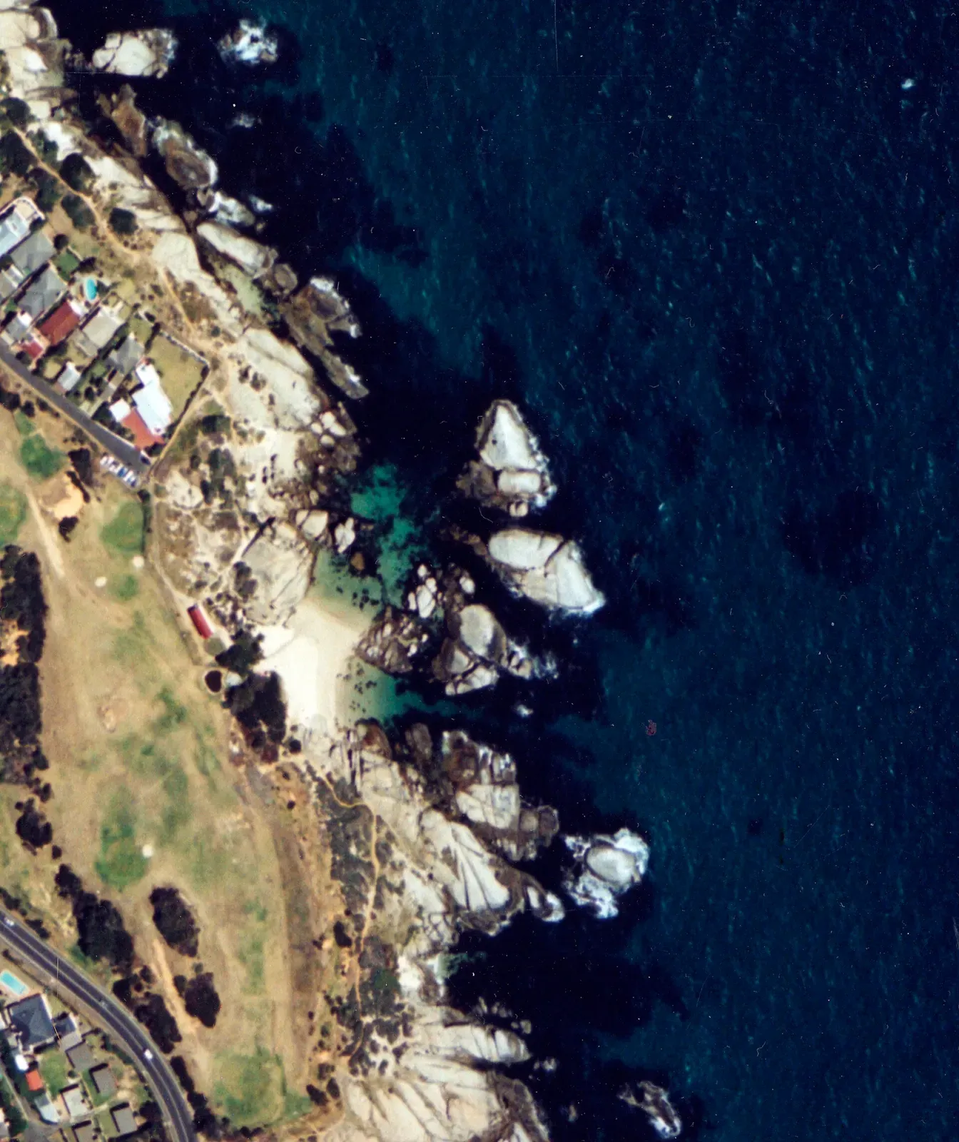 Aerial view of the Windmill Beach coastline showing its rocky coves near Seaforth and Froggy Pond — Cape Town