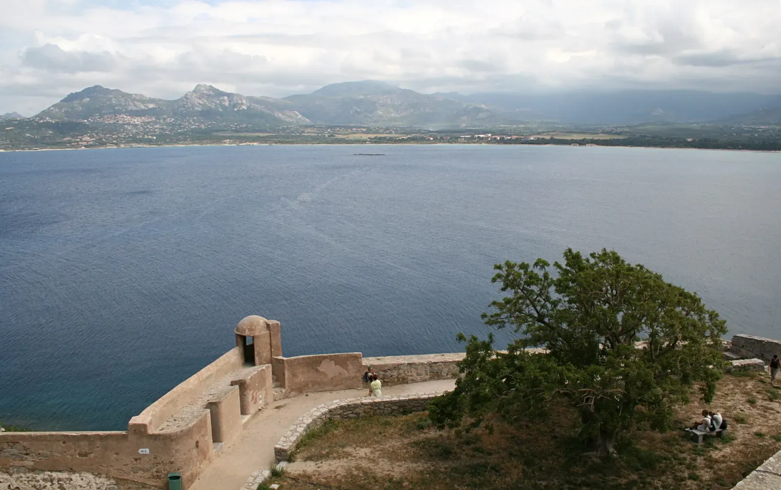 Watchtower on Calvi's citadel wall looking out over the wide bay toward the mountains