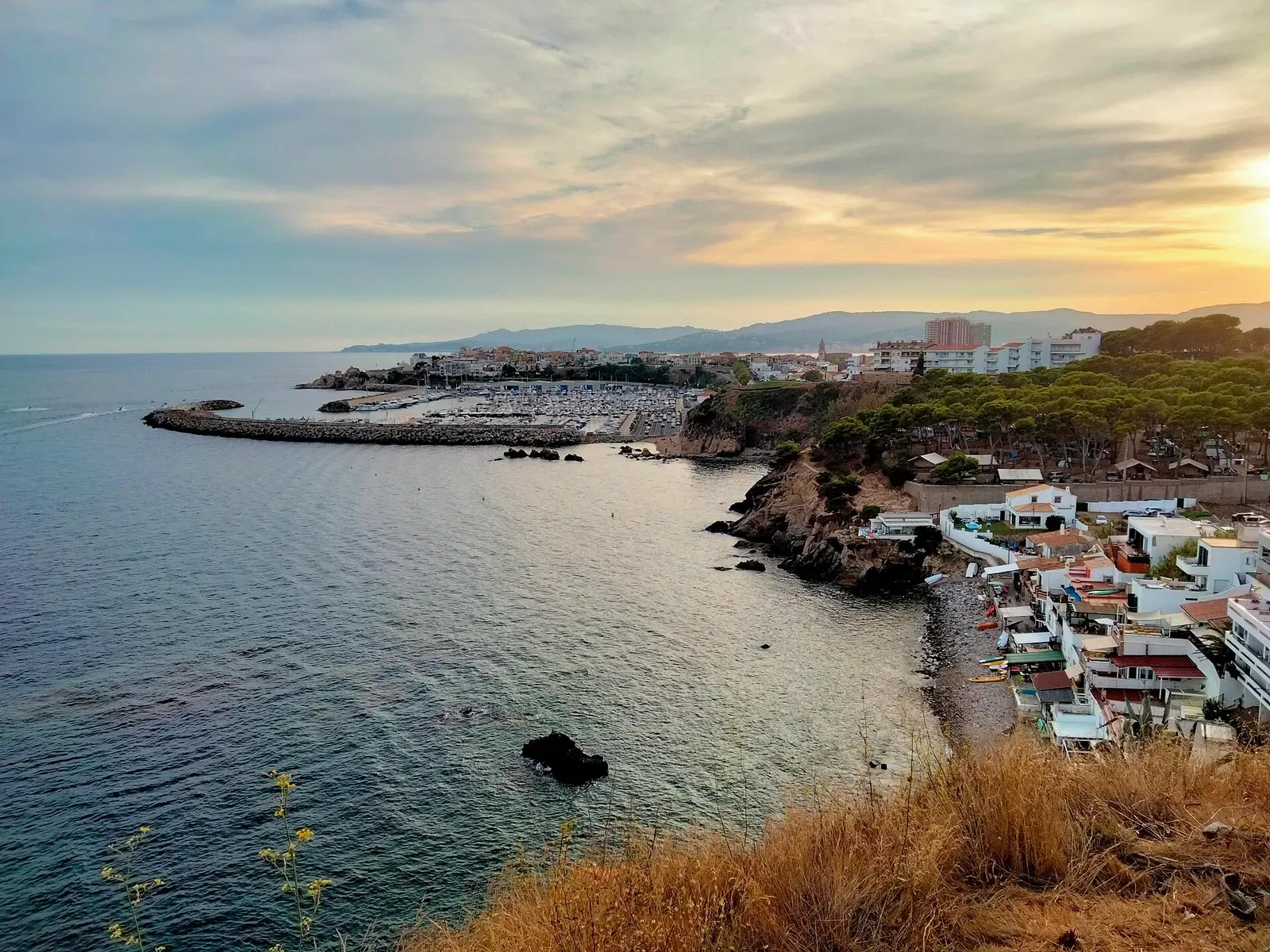 Cala Margarida and the Palamós marina seen from Cap Gros at dusk