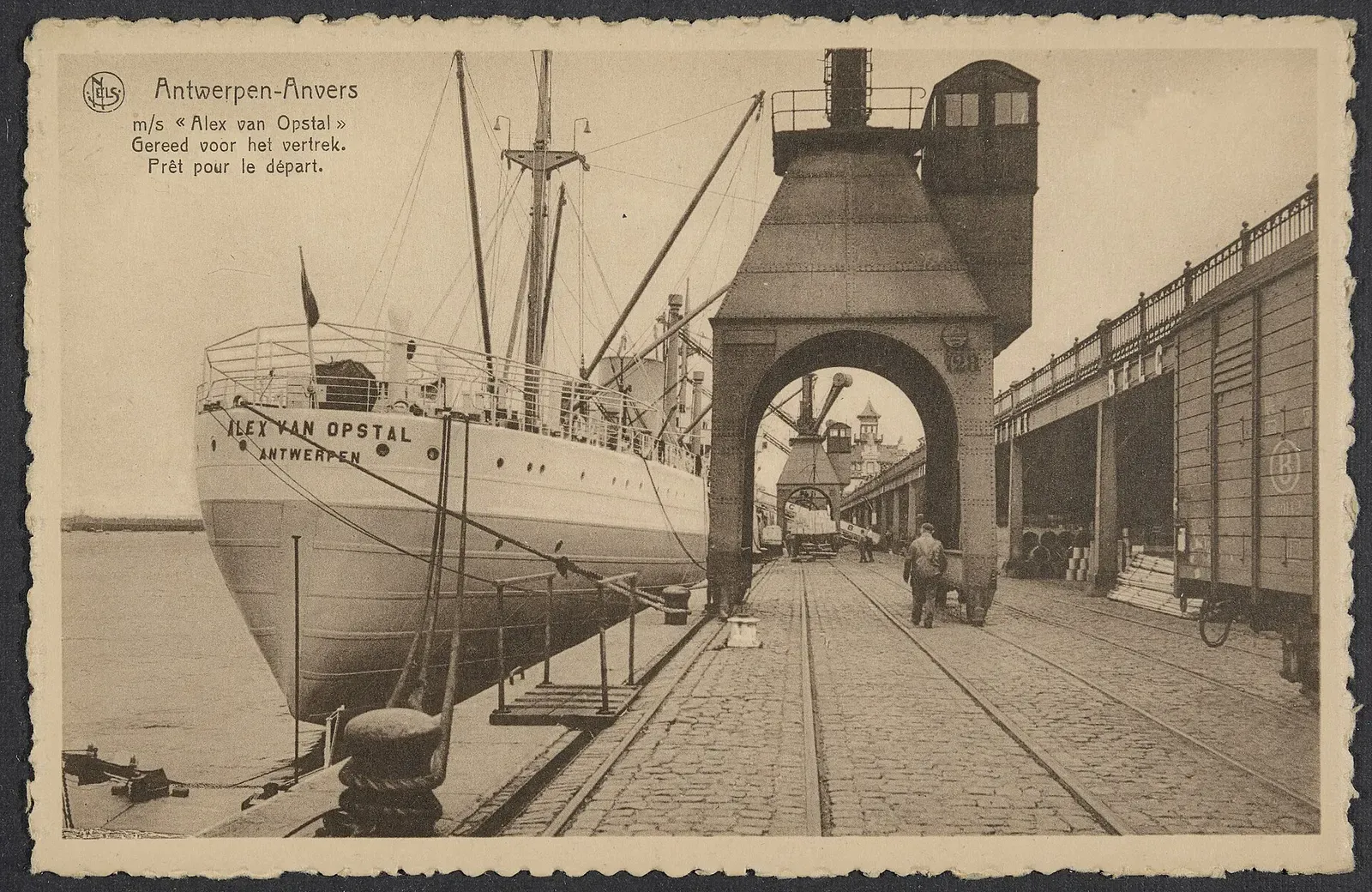 Alex Van Opstal alongside a dockside crane gantry, ready to depart Antwerp