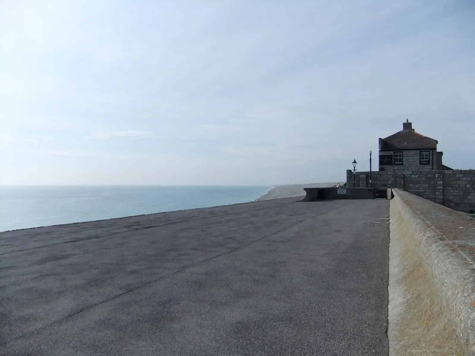 The sea wall at Chesil Cove looking north-west along Chesil Beach