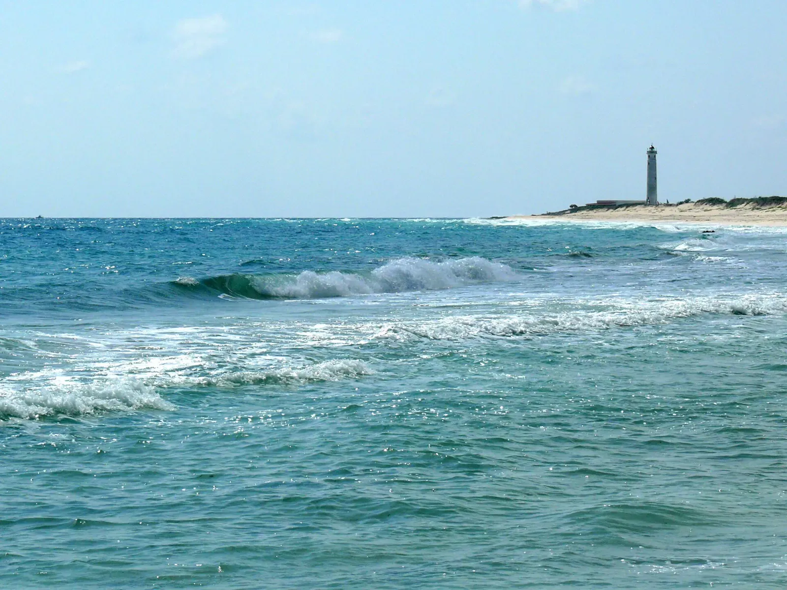Windward shoreline looking toward the Punta Sur lighthouse in the distance — Cozumel