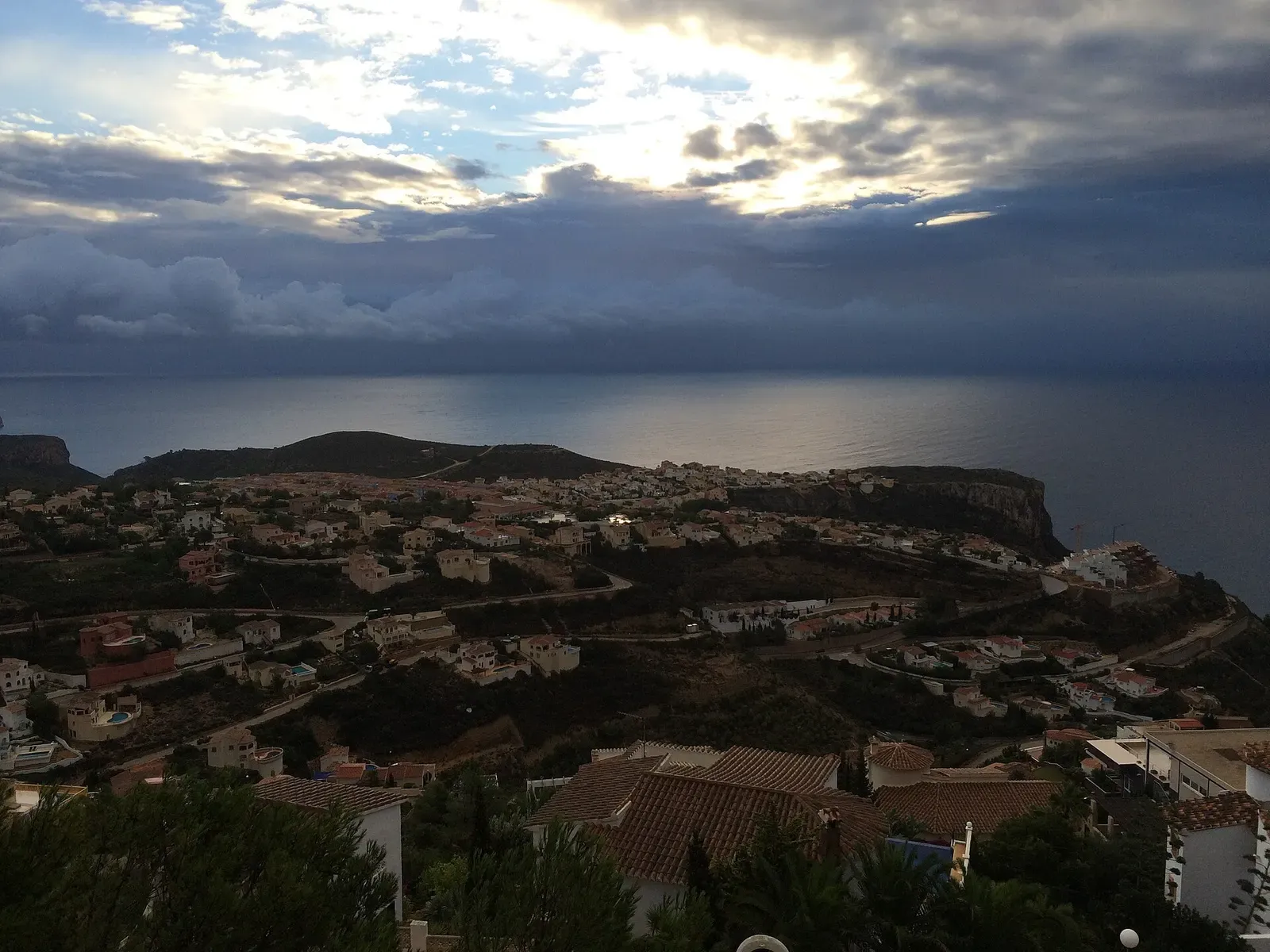 Hillside village of Cumbre del Sol overlooking the sea at dusk near Benitachell