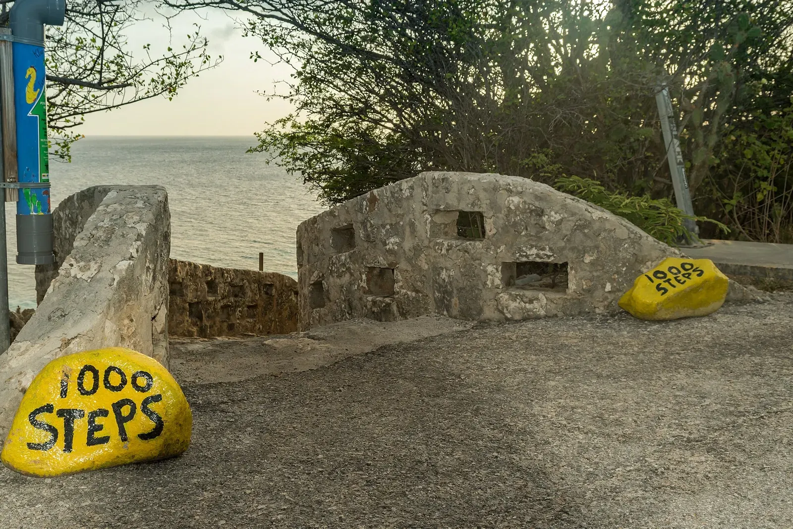 Weathered concrete pillbox overlooking the sea at the top of the 1000 Steps entry — Bonaire