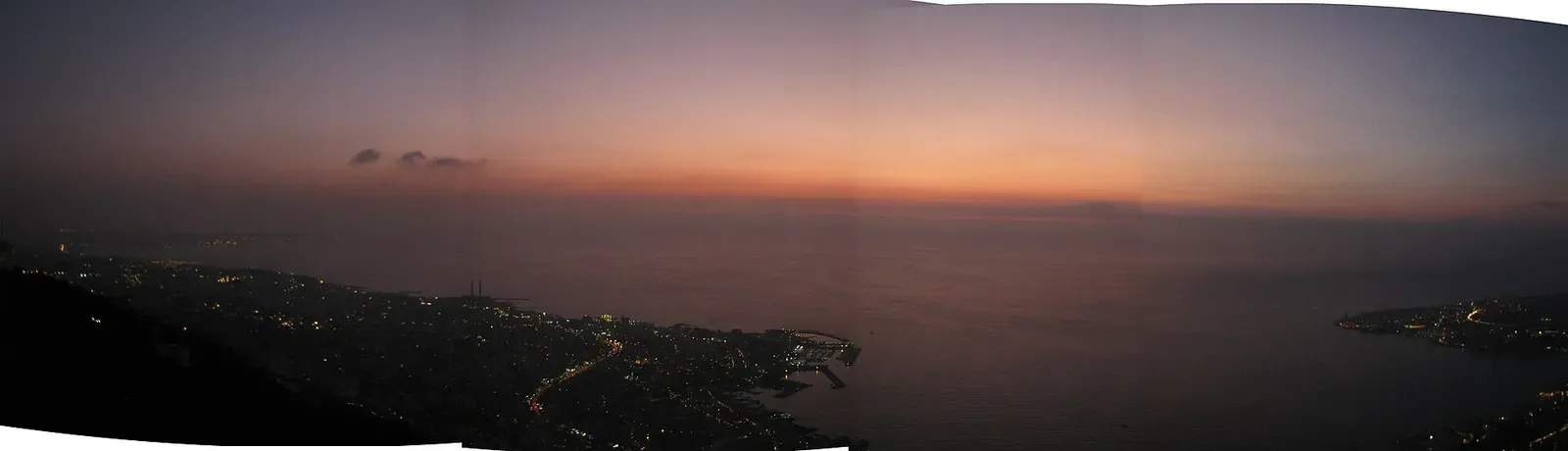 Dusk over the Mediterranean from the heights above Jounieh, with the lights of the town and its harbour below