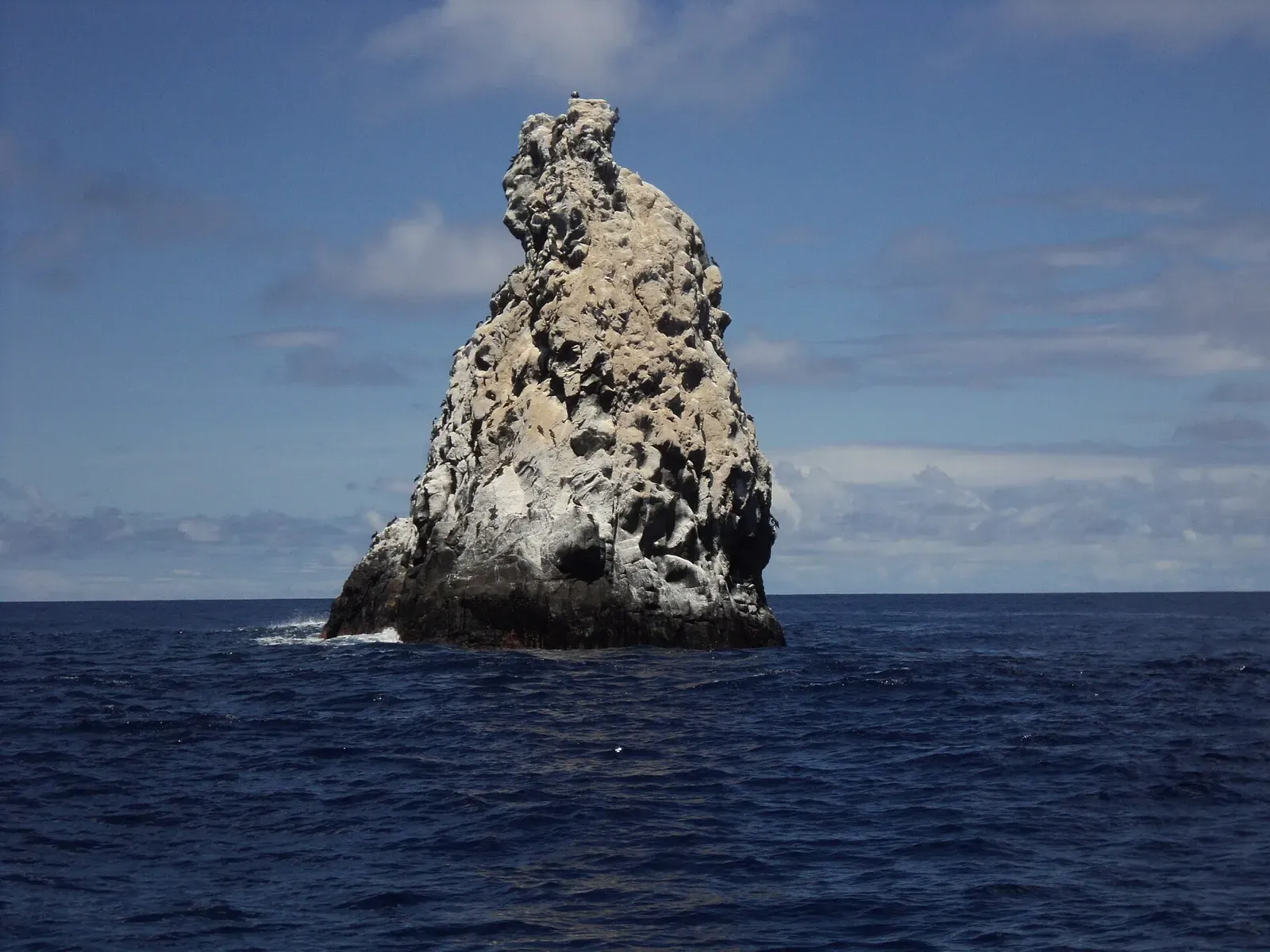 Roca Partida's twin rock spires rising from calm blue water on a clear day — Socorro Island.