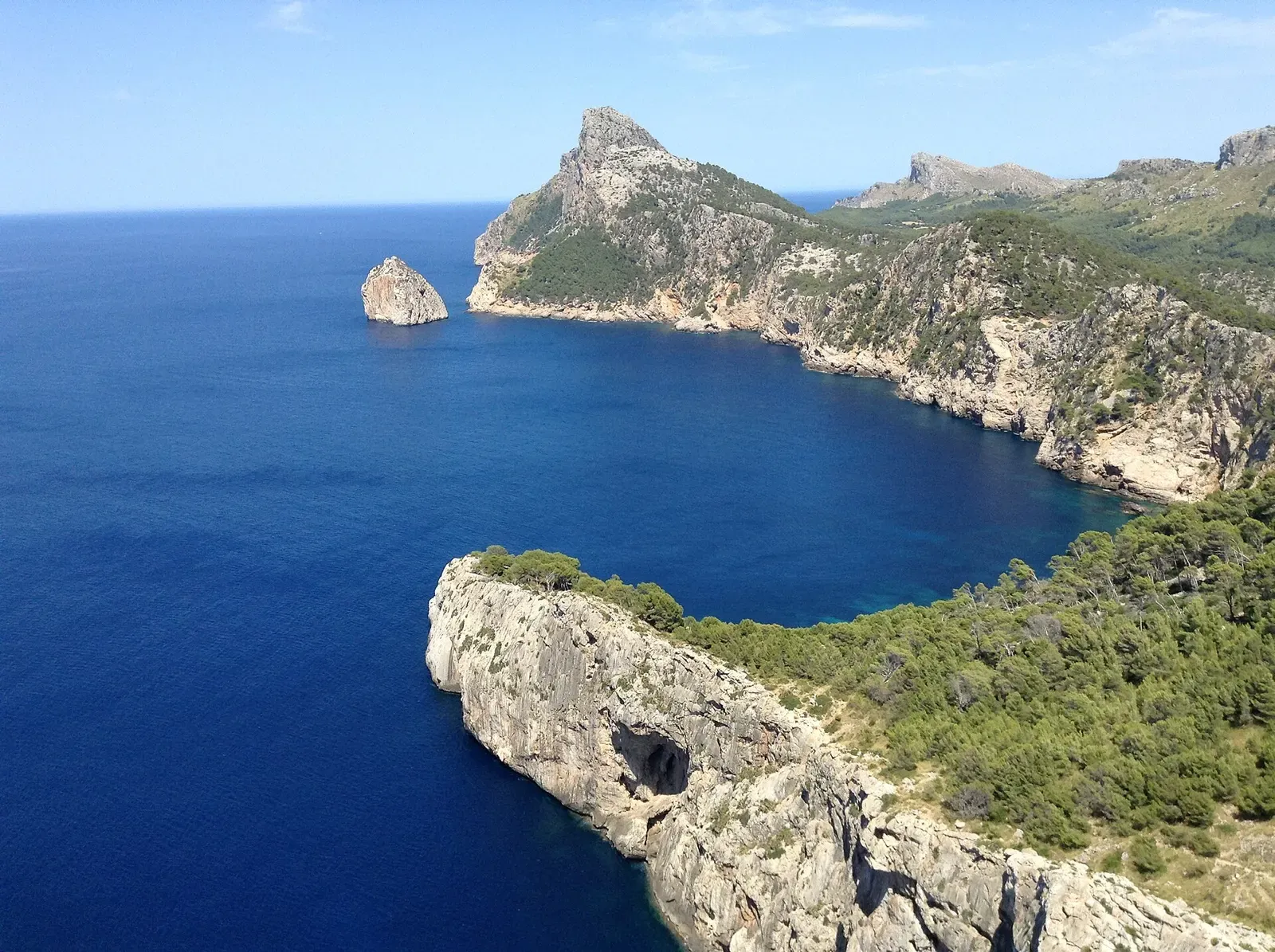 Wide view of the jagged coastline and open sea seen from Mirador Es Colomer