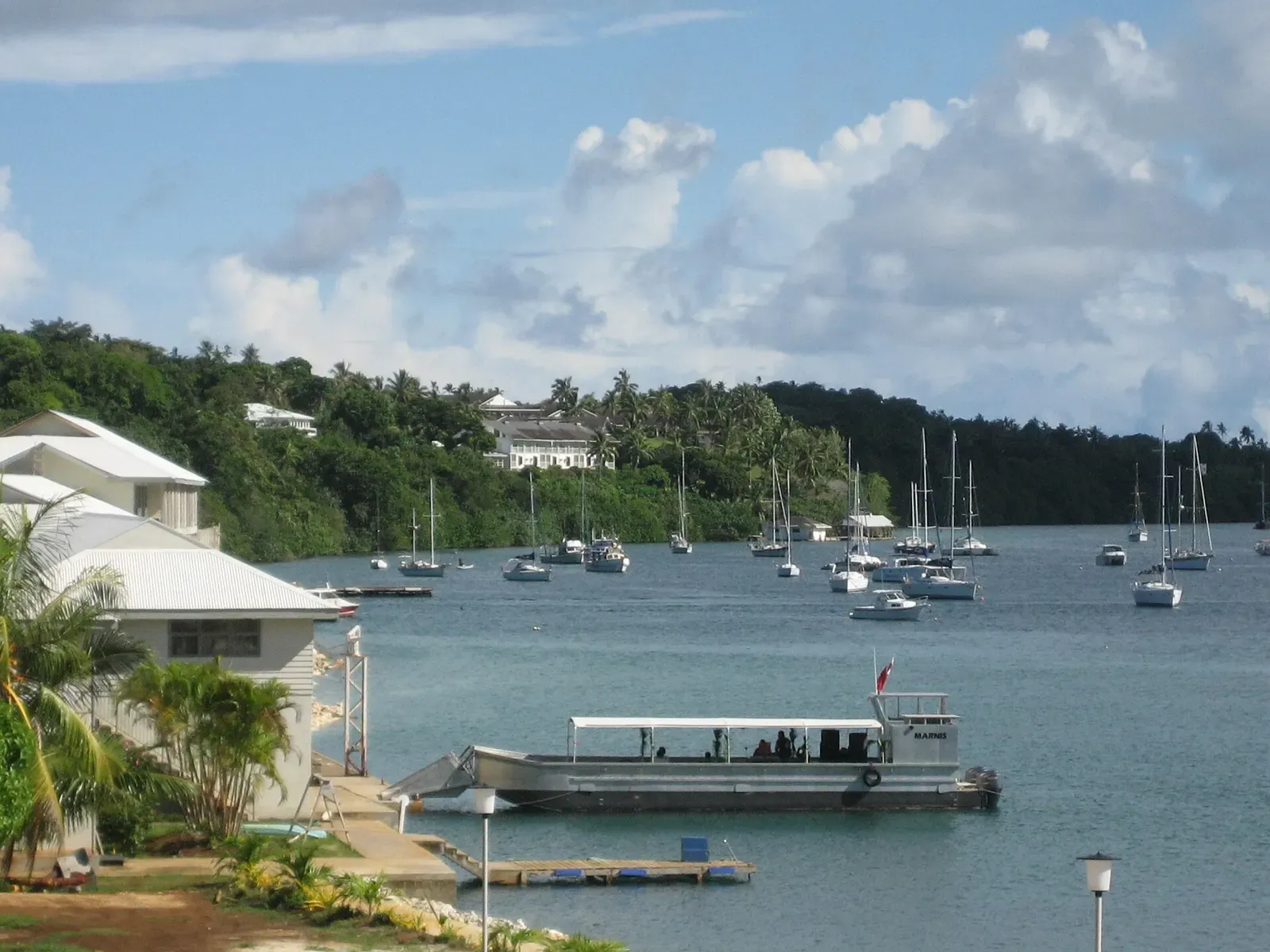 Dive boat docked at the Bounty Bar waterfront overlooking Neiafu harbour — Vava'u