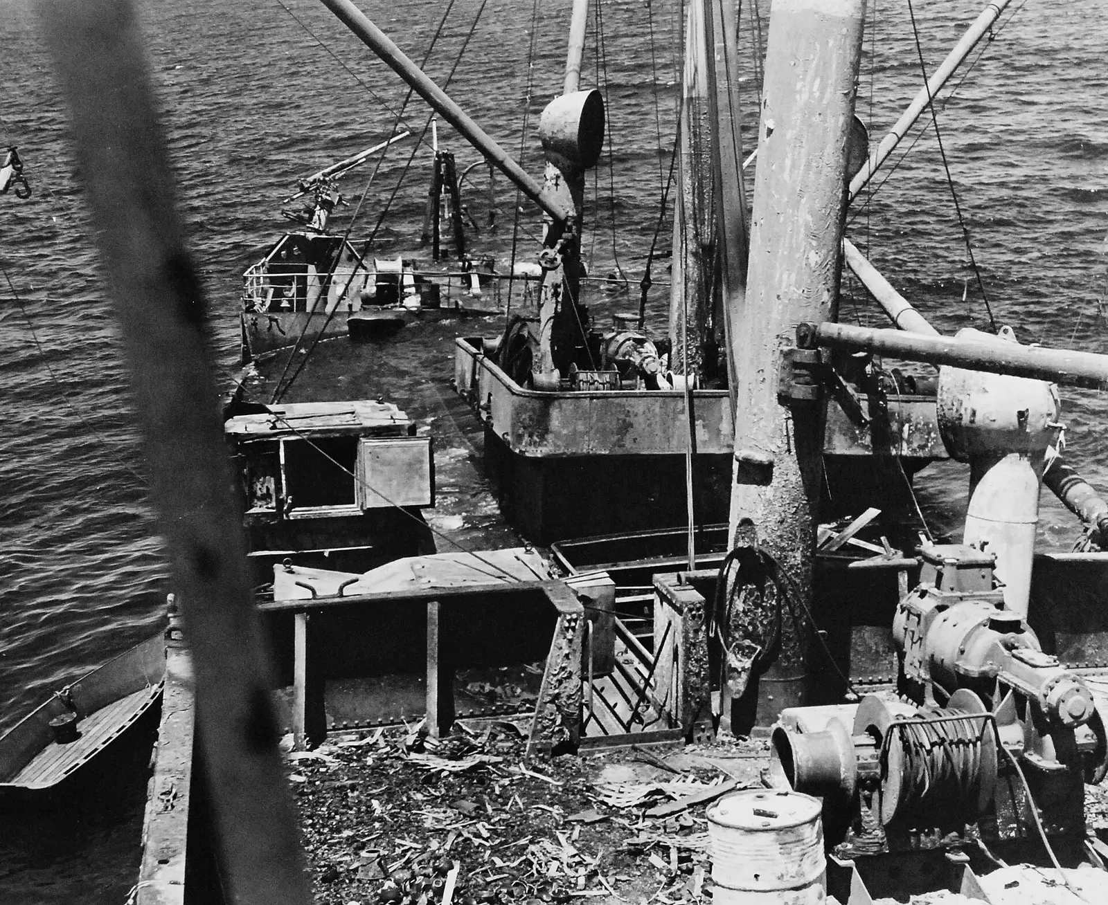 Close-up of the battered afterdeck and rigging of the beached Kinugawa Maru — Bonegi II, Iron Bottom Sound