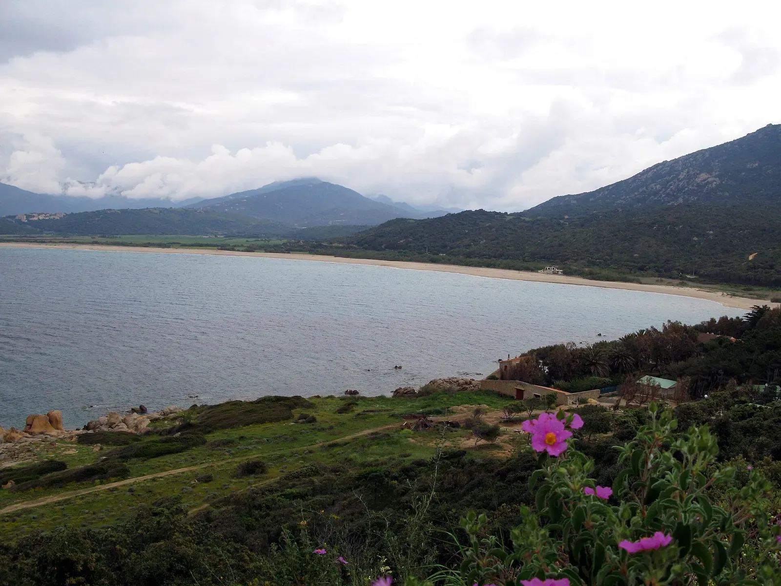View of a beach and bay along the Golfe de Valinco coast from a coastal trail, Corsica.