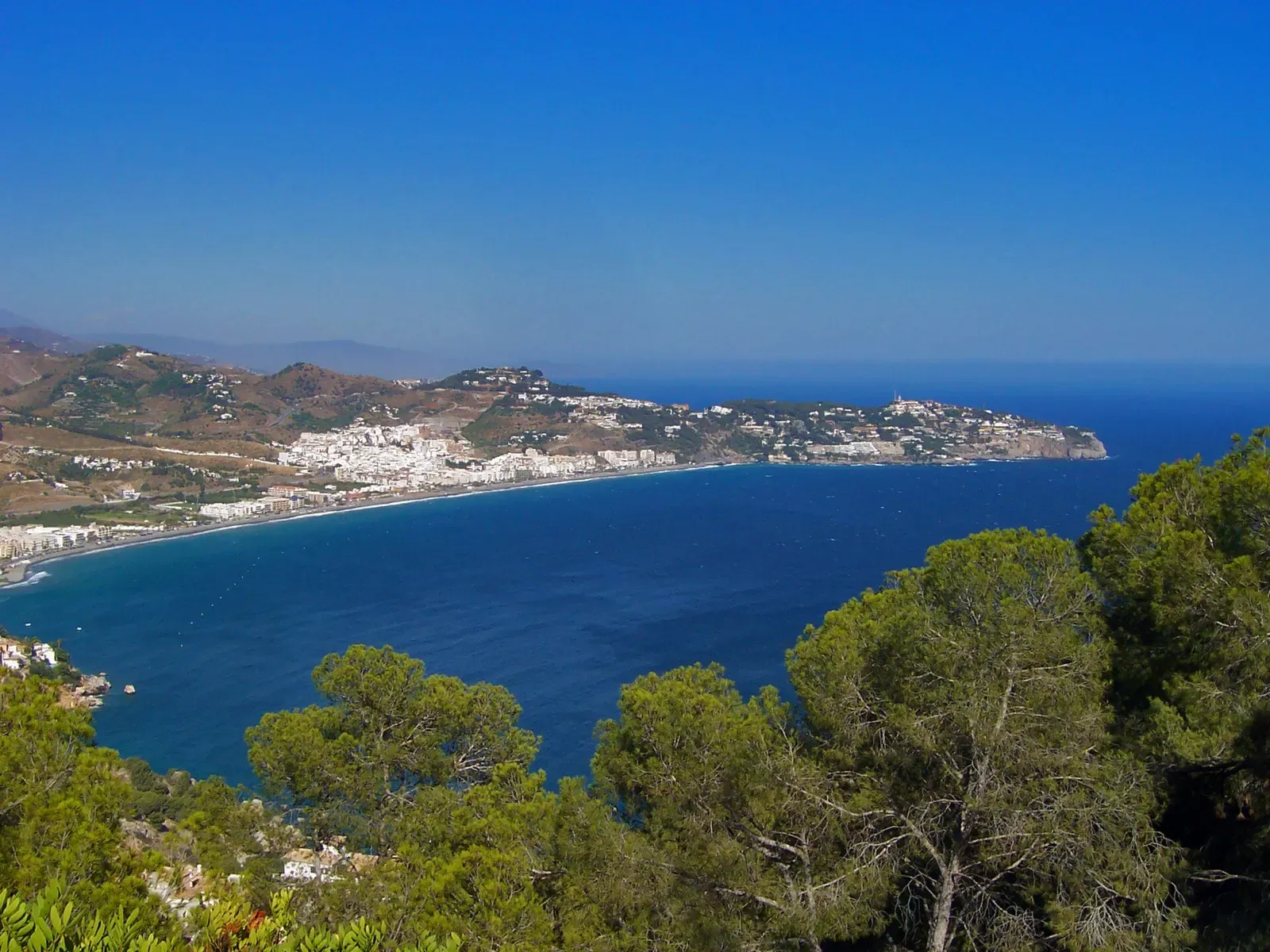 La Herradura's bay and village seen from the cliffs of Cerro Gordo.