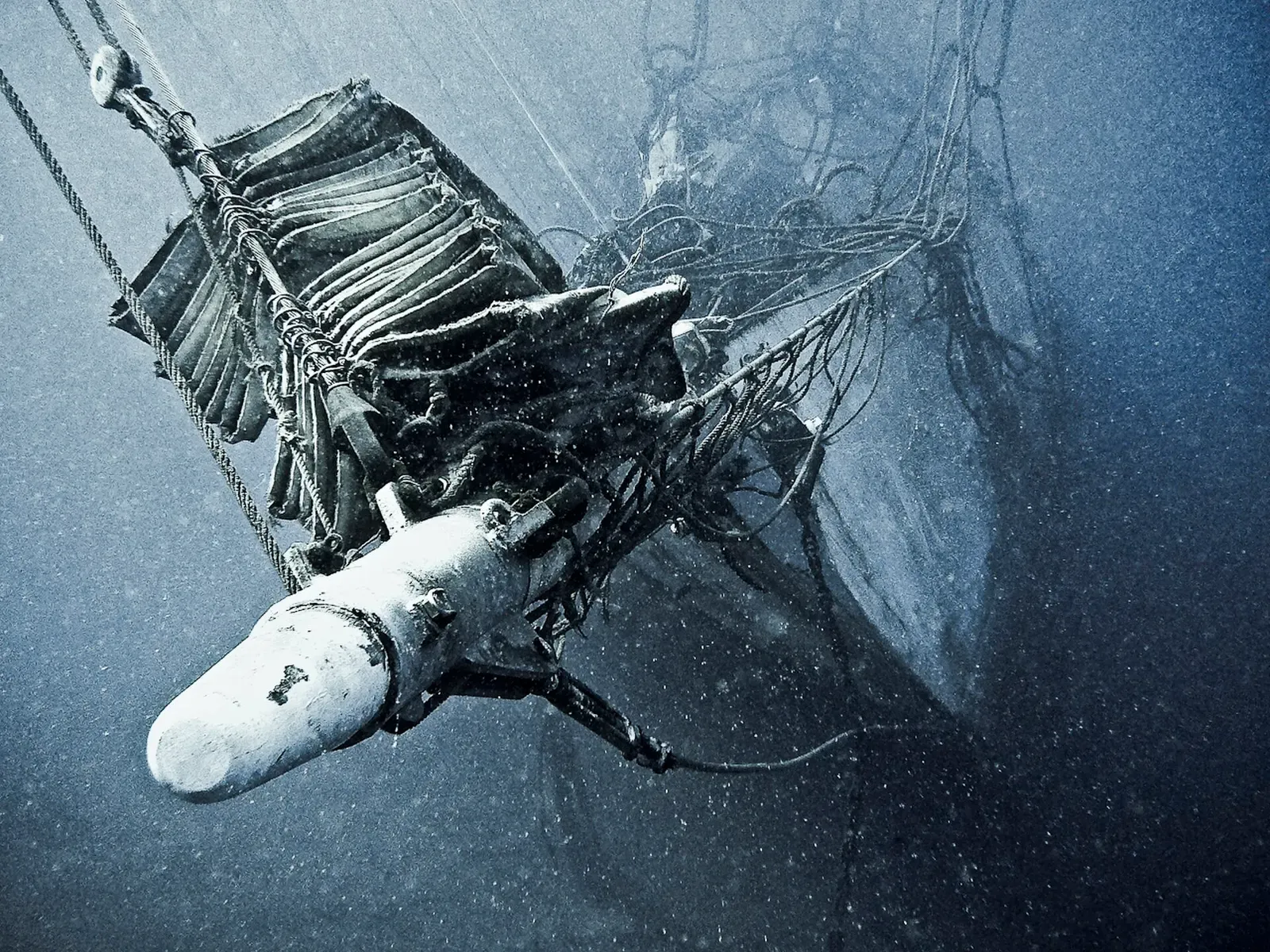 Mast and rigging cables draped across the wreck of the schooner Dwyn Wen — Mayotte