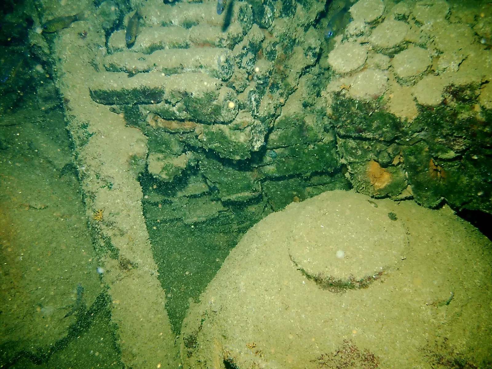 A naval mine and artillery shells inside the San Francisco Maru — Chuuk Lagoon