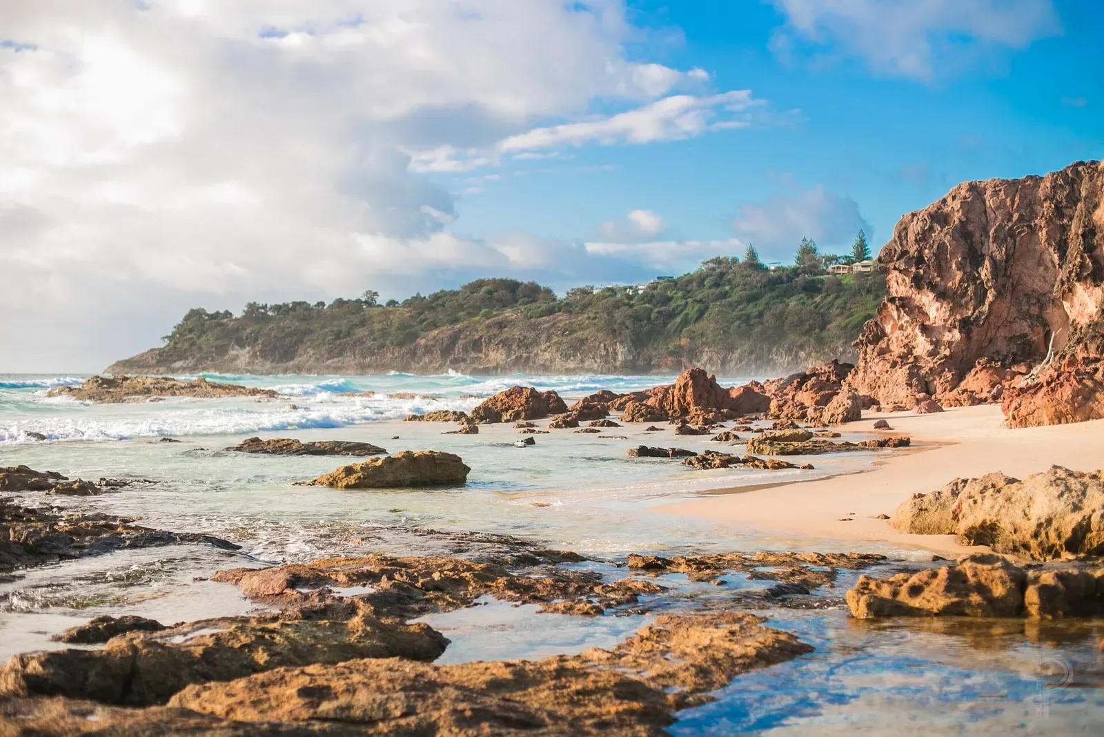 Morning light over a rocky cove with tide pools on the coast at Point Lookout.