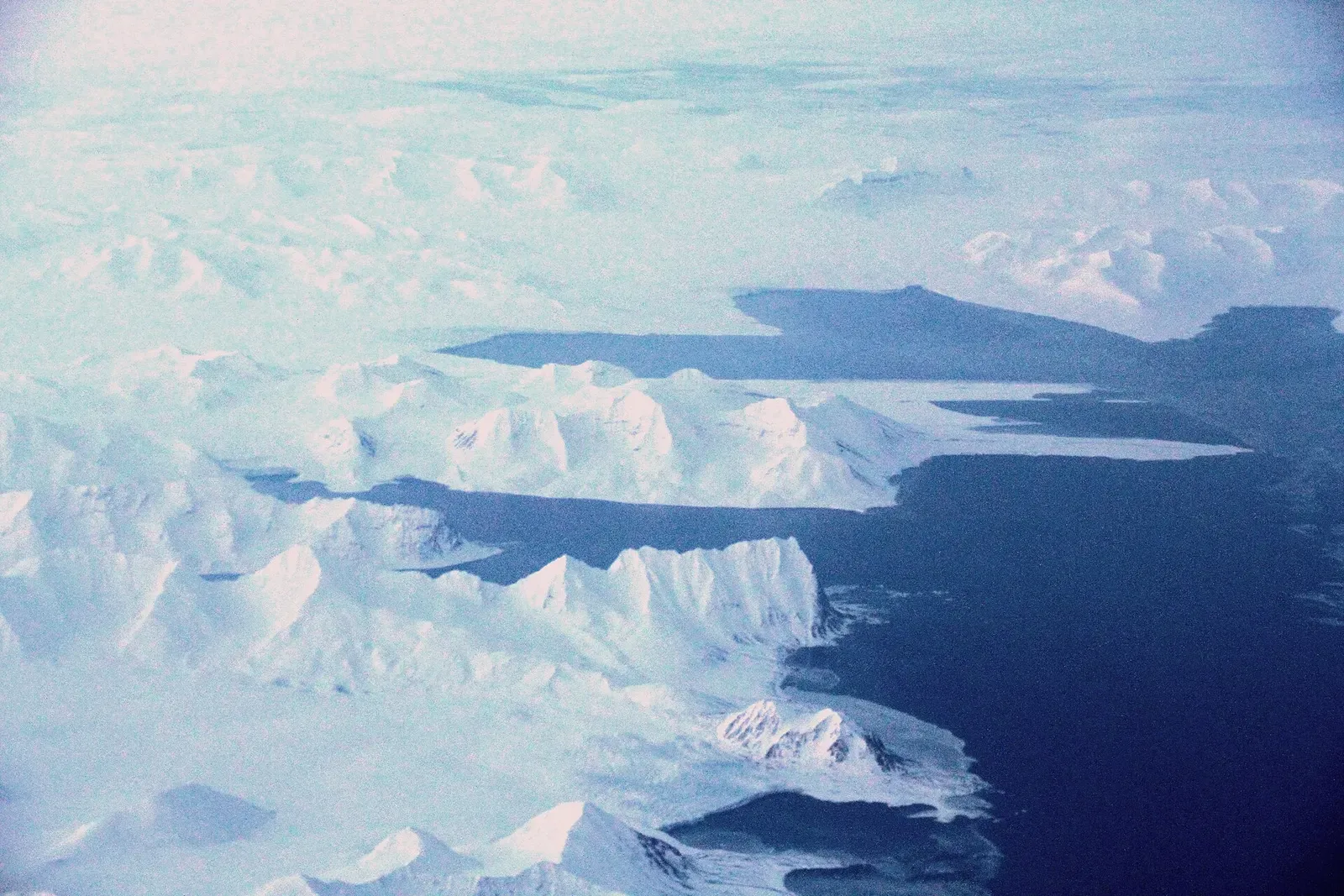 Aerial view of glacier-carved ice channels draining into the inner reaches of Hornsund fjord — Svalbard.