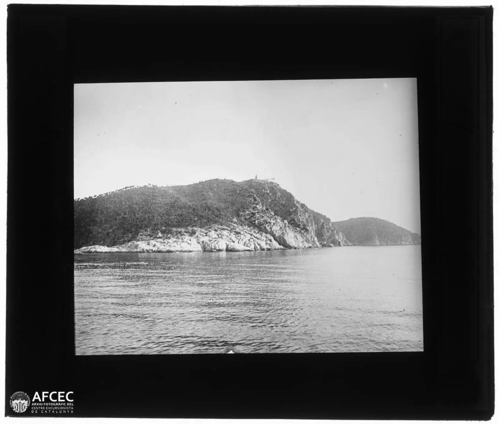 Historic photograph of Cap de Sant Sebastià seen from the sea
