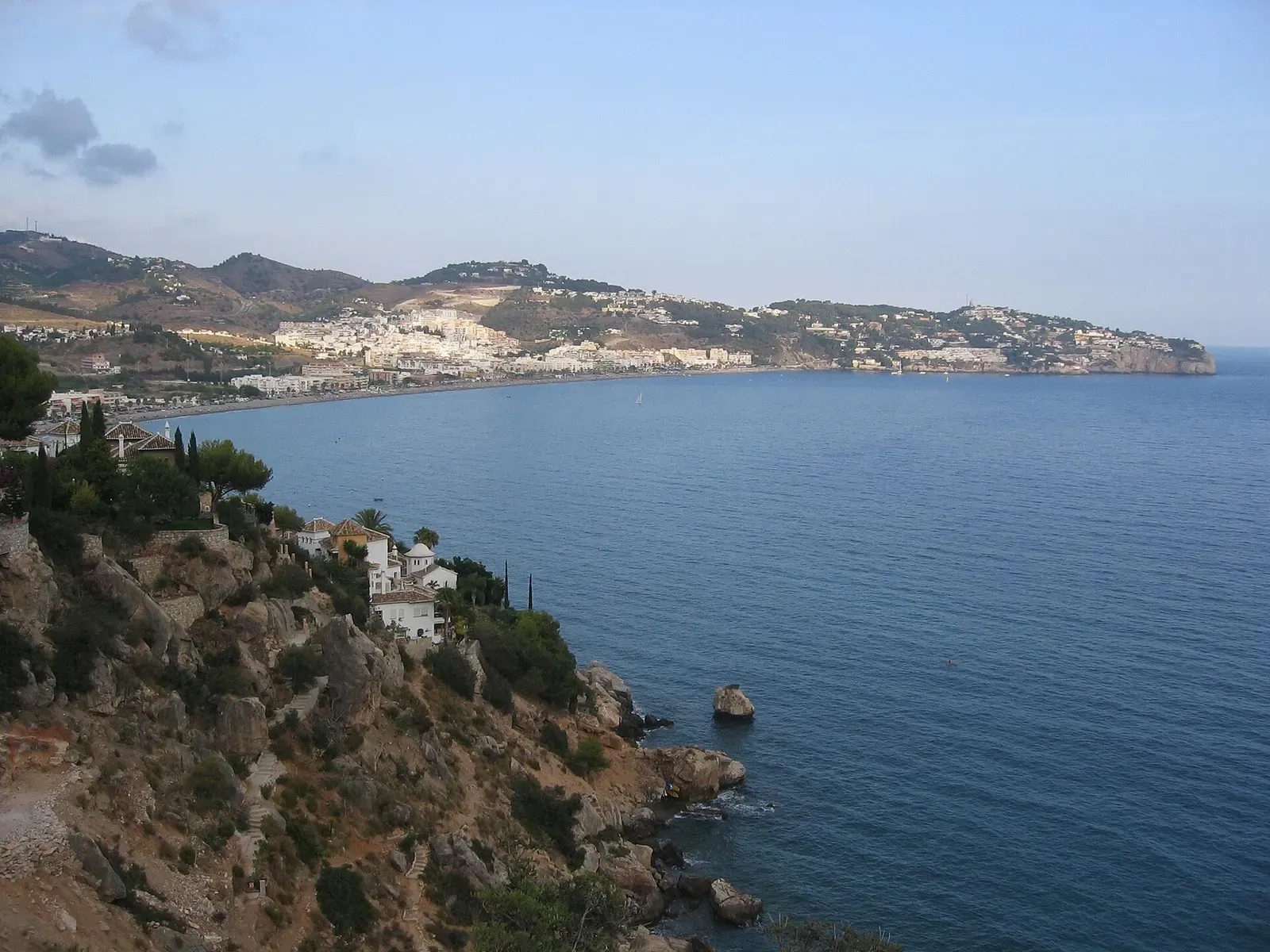 A view of La Herradura's bay and village from the surrounding coastal hills.