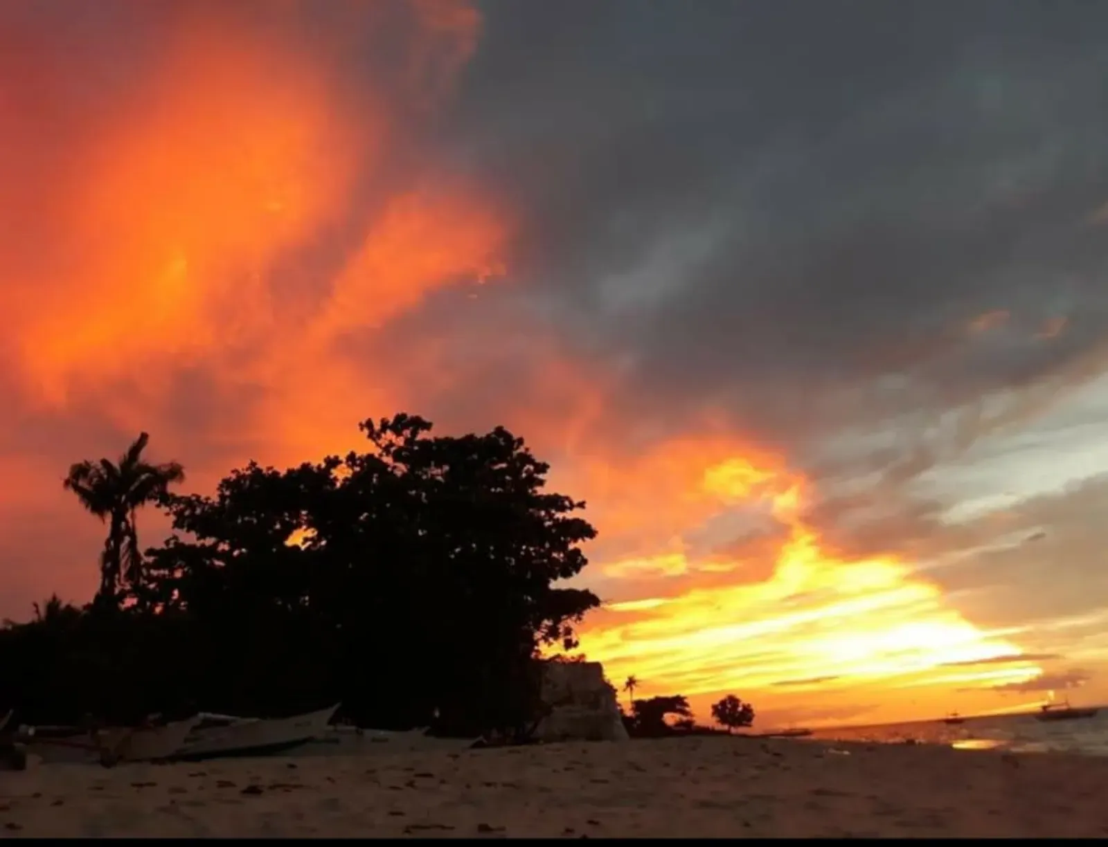 Sunset over the sea from Pamilacan Island's beach