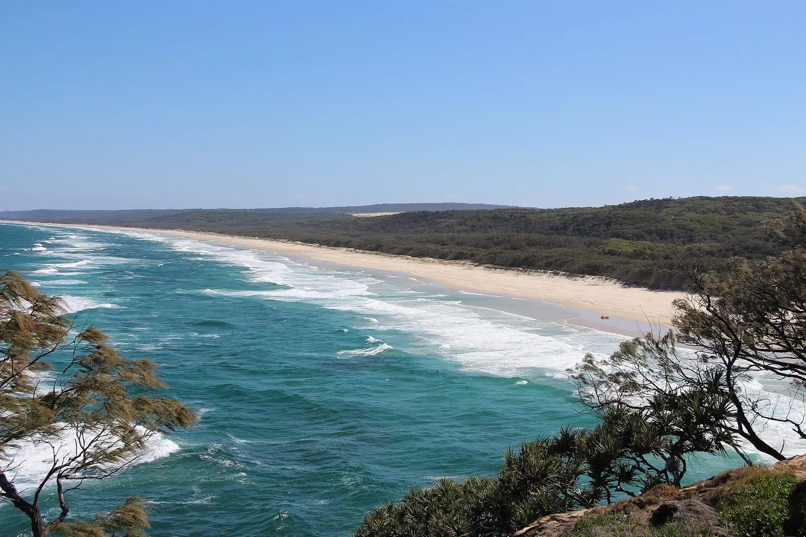 Aerial view along the long sandy sweep of Main Beach from the Point Lookout headland.