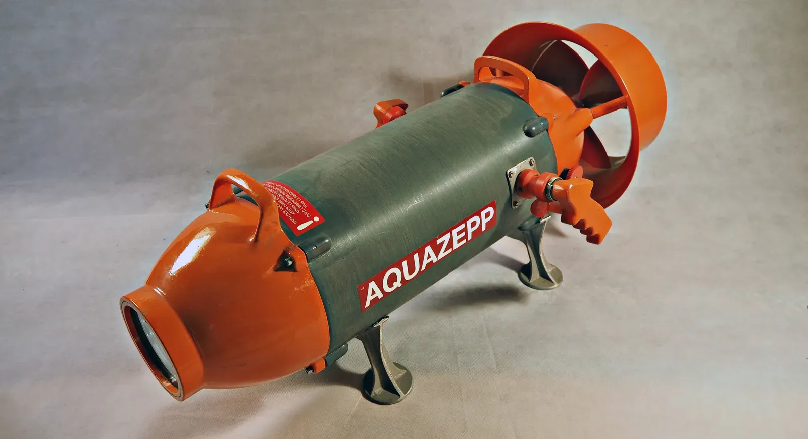 An Aqua Zepp LT30 diver propulsion vehicle out of the water, showing its shrouded propeller and trigger handle